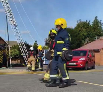 Carrying the 30kg barbell 
Photo: Neil Horne