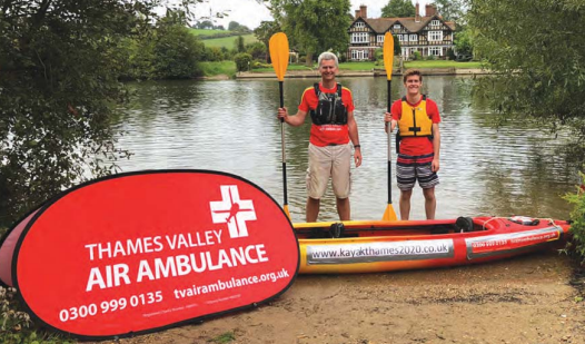 Keith and Sebastian with the Air Ambulance logo